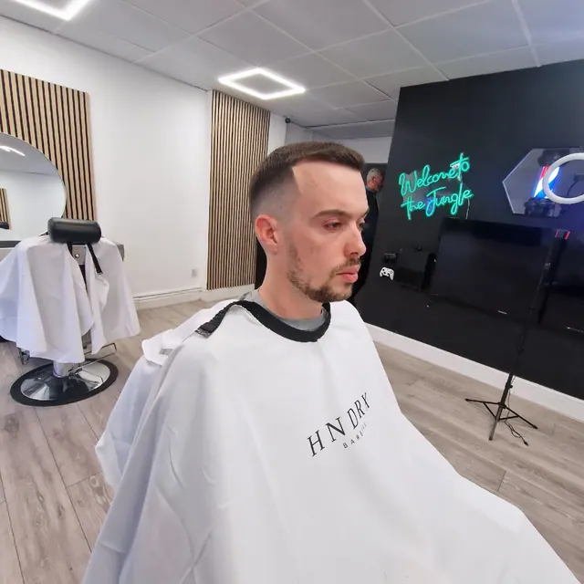 A cut in progress at HNDRX Barbers